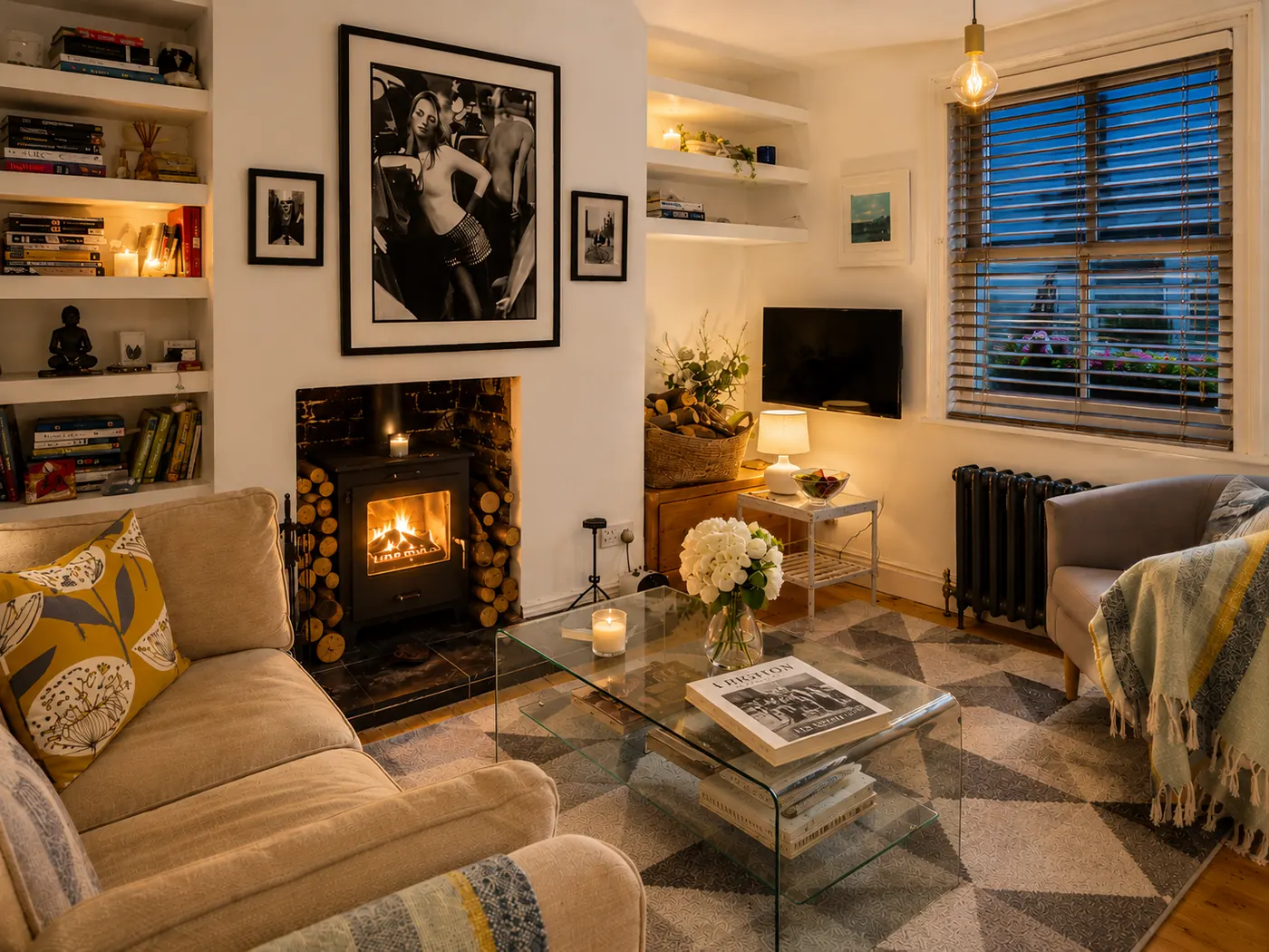 Living room with the wood burner lit at dusk
