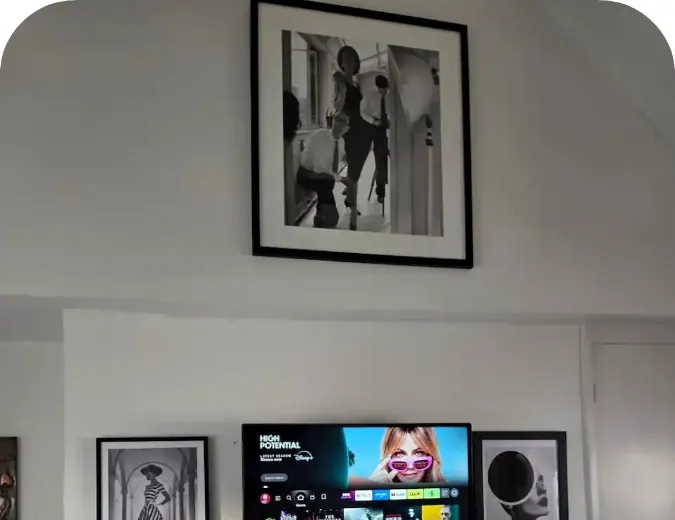 Main bedroom television and framed artwork